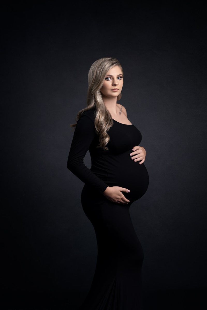 Maternity portrait in a black dress