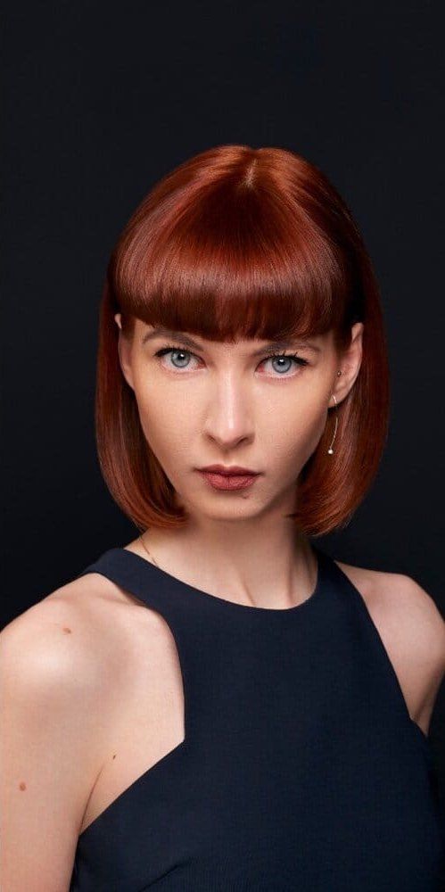 Portrait of a woman with red hair after retouching